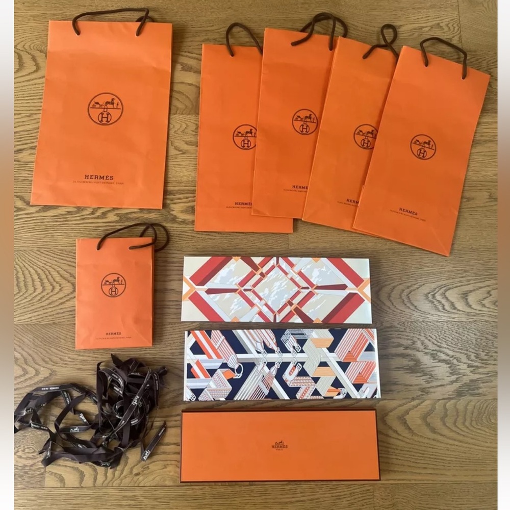 Lot of authentic Hermes shopping bags boxes and ribbon